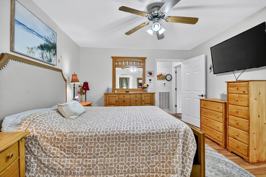 66 Westward Lane Blue Ridge, GA 30513 - Photo 27 of 34 a bedroom with a bed and a flat screen tv