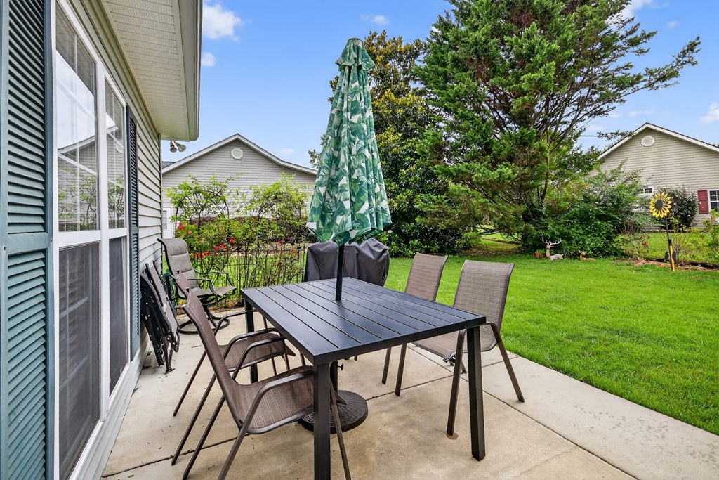 66 Westward Lane Blue Ridge, GA 30513 - Photo 6 of 34 a view of a patio with a table chairs and a yard