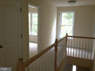 519 Koch Road Linthicum Heights, MD 21090 - Photo 12 of 29 Upstairs Hallway w/wood railings