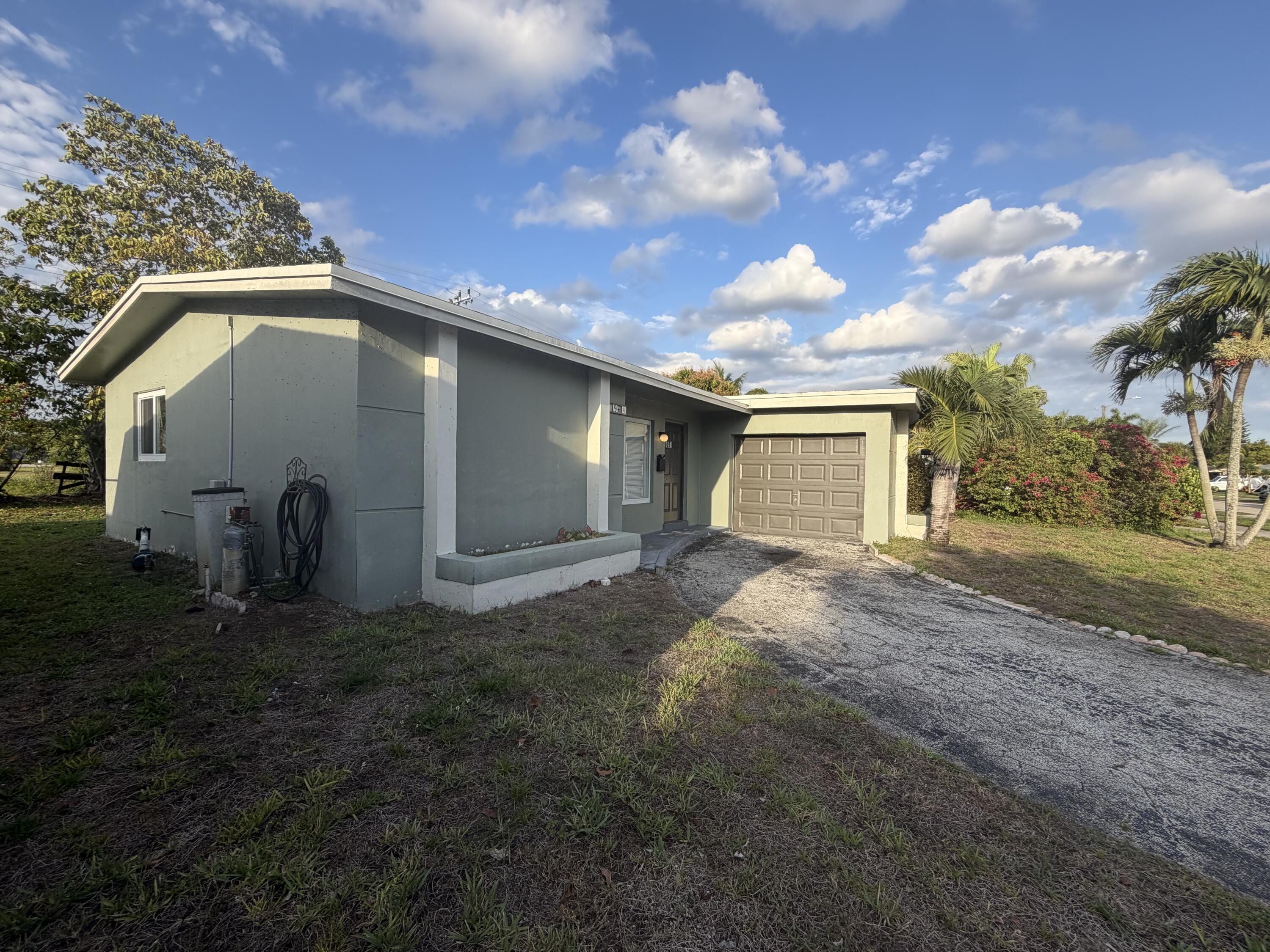 6691 Northwest 30th Street Sunrise, FL 33313 - Photo 1 of 26 a view of a back yard of the house