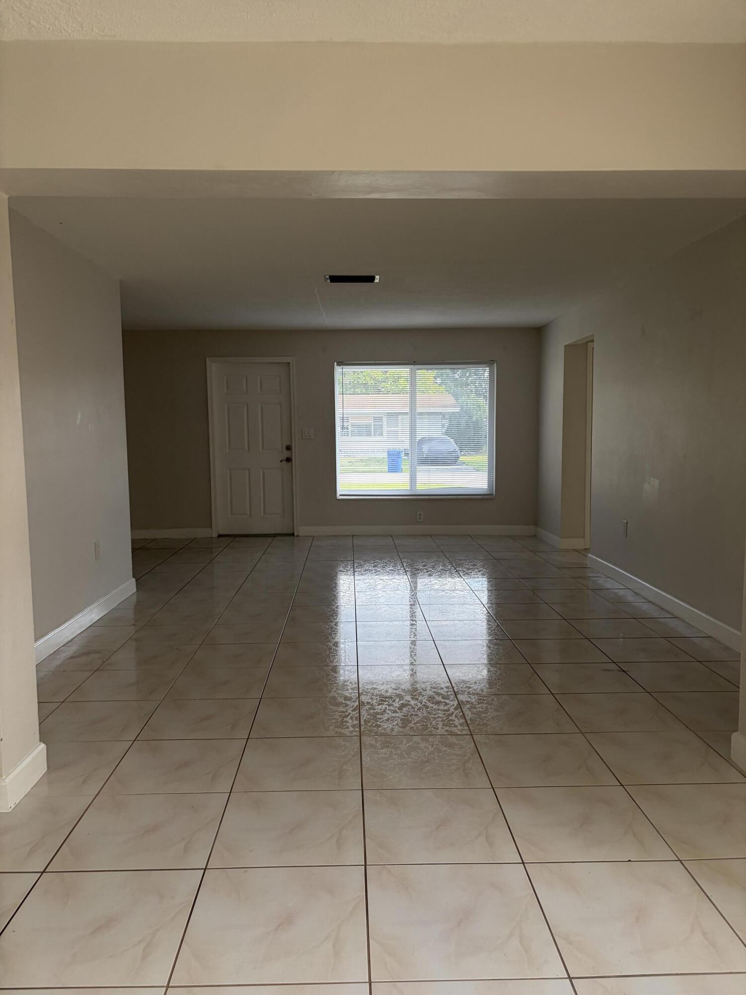 6691 Northwest 30th Street Sunrise, FL 33313 - Photo 11 of 26 a view of an empty room with a window