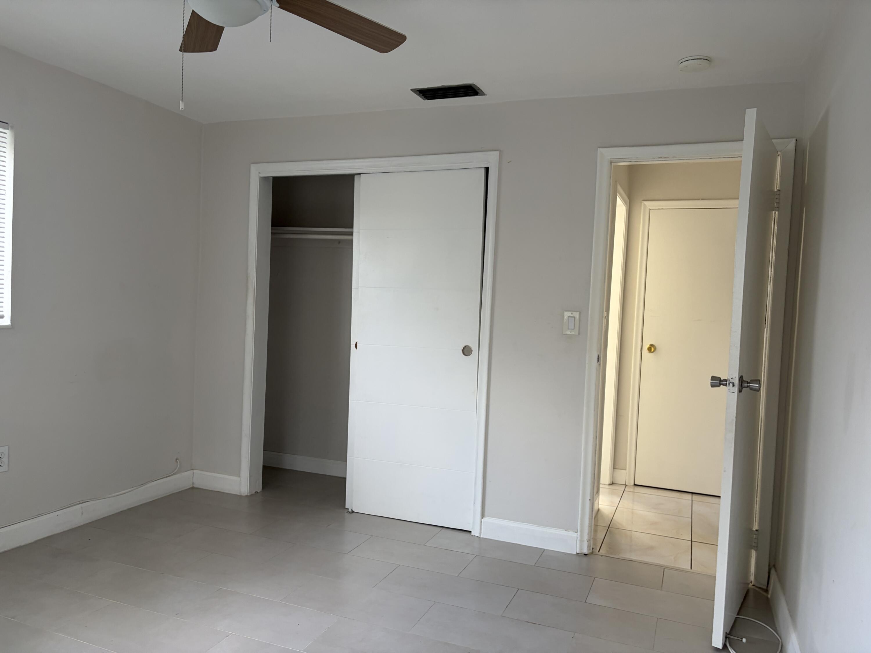 6691 Northwest 30th Street Sunrise, FL 33313 - Photo 14 of 26 an empty room with closet