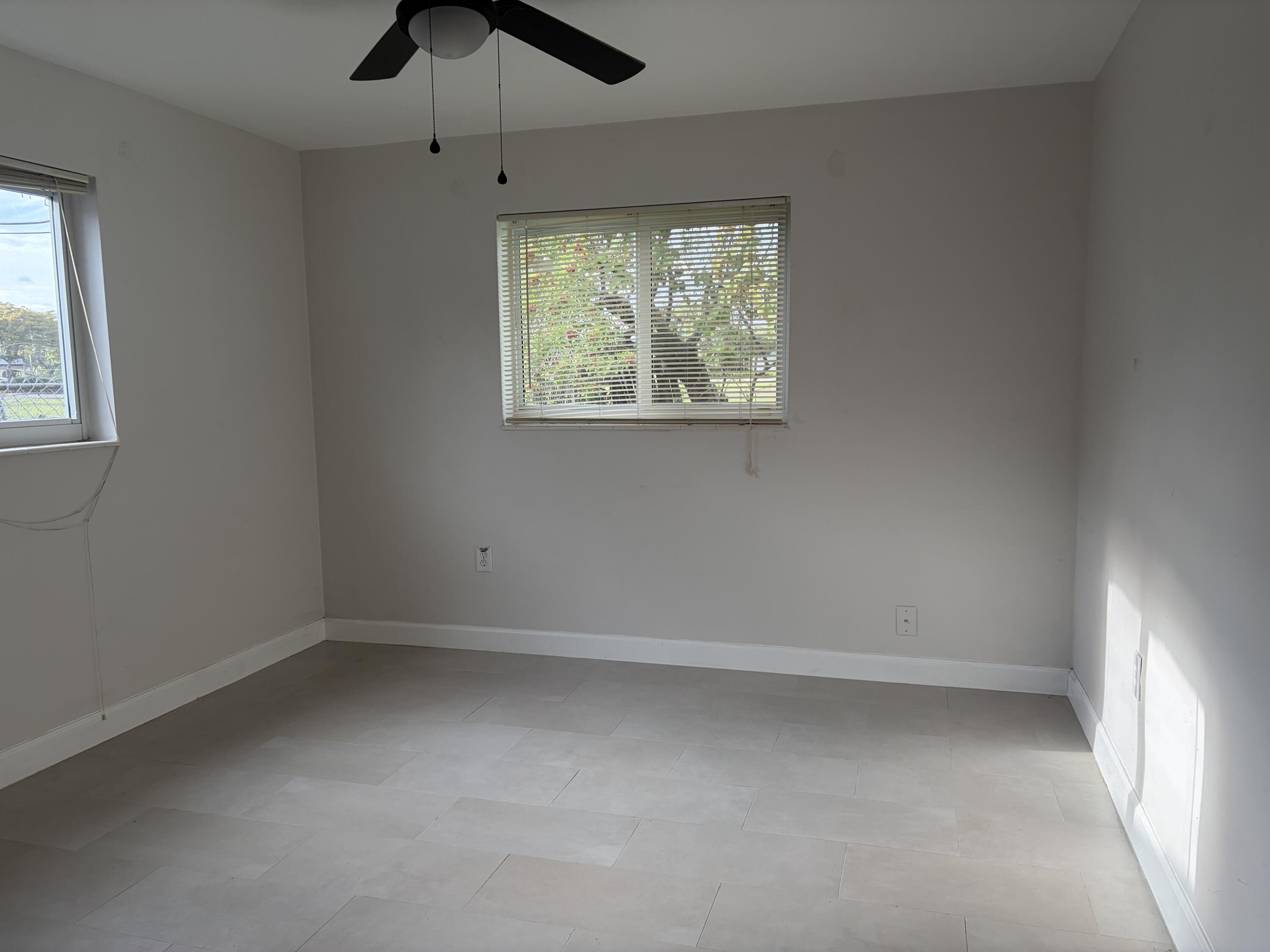 6691 Northwest 30th Street Sunrise, FL 33313 - Photo 16 of 26 an empty room with a window