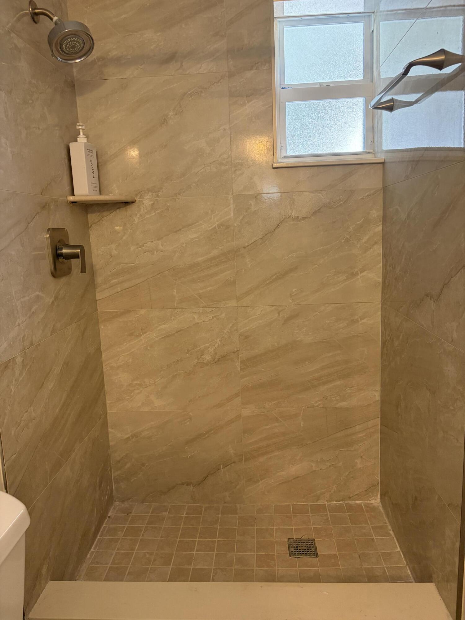 6691 Northwest 30th Street Sunrise, FL 33313 - Photo 20 of 26 a bathroom with a shower