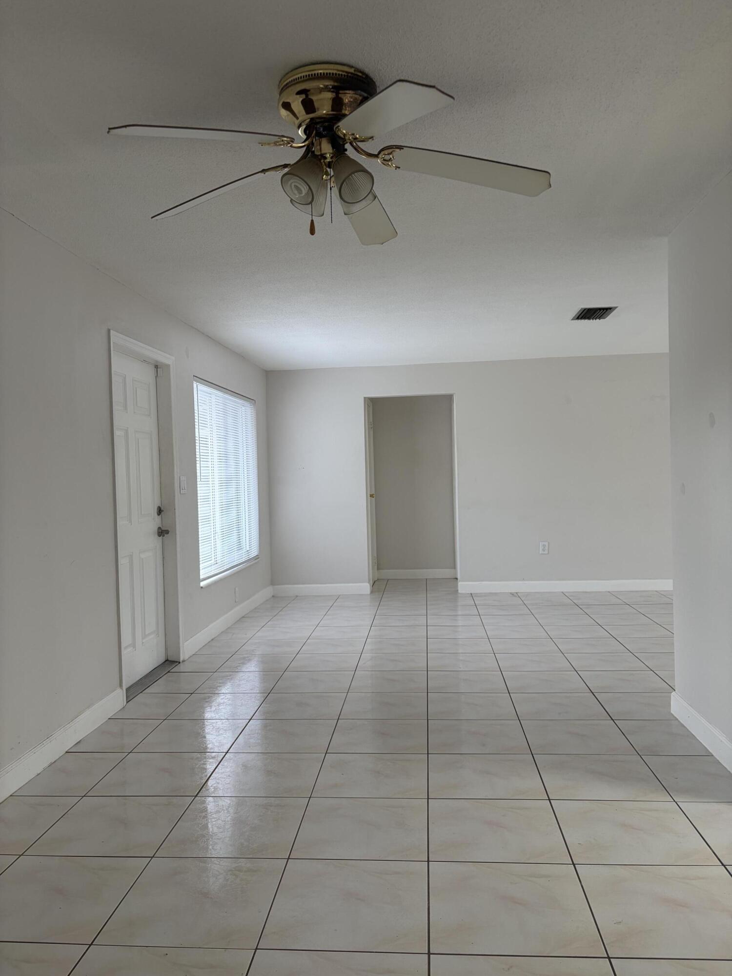 6691 Northwest 30th Street Sunrise, FL 33313 - Photo 21 of 26 a view of an empty room with a window