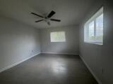6691 Northwest 30th Street Sunrise, FL 33313 - Photo 22 of 26 an empty room with a window and a fan