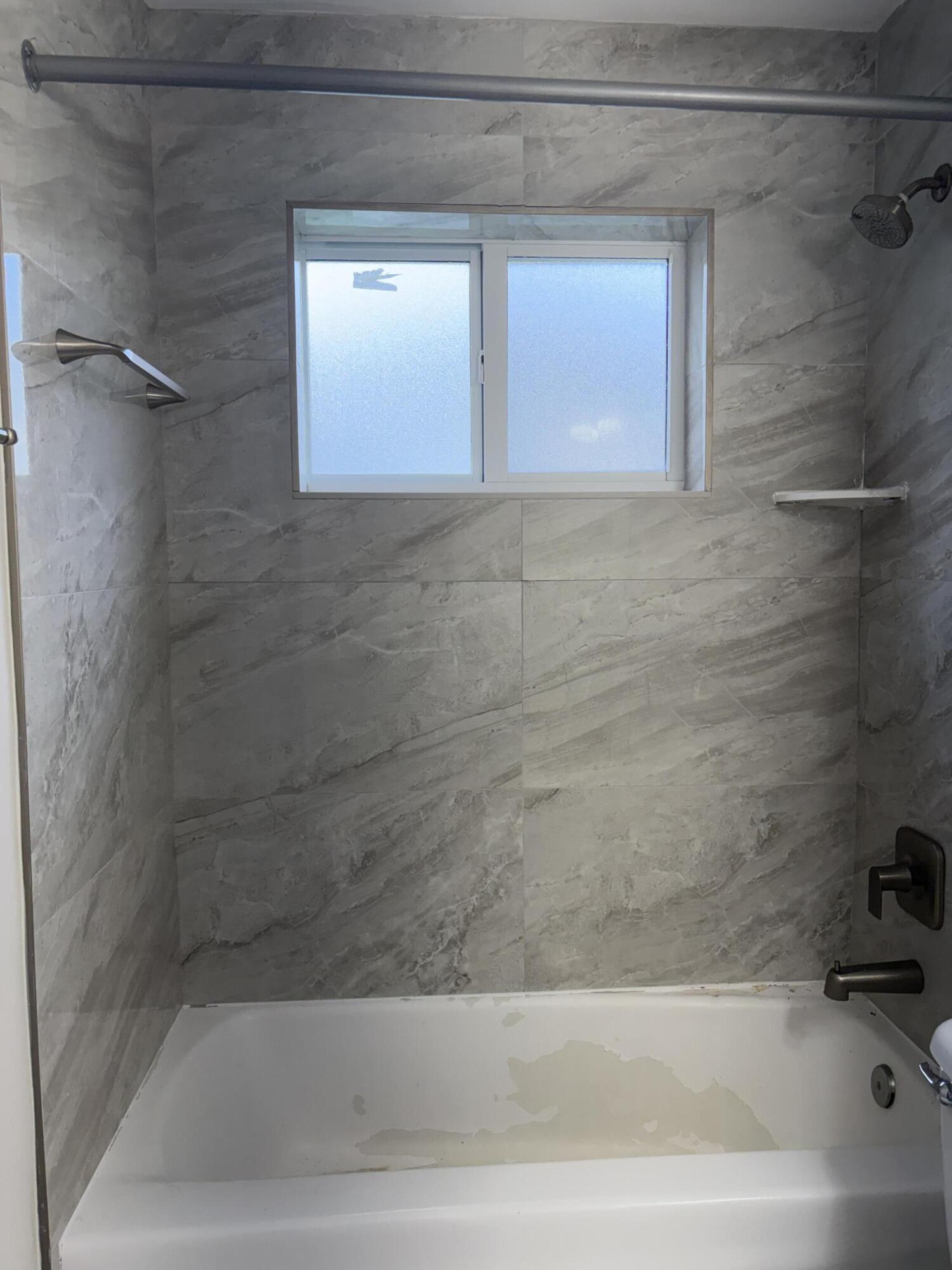 6691 Northwest 30th Street Sunrise, FL 33313 - Photo 23 of 26 a bathroom with a bathtub