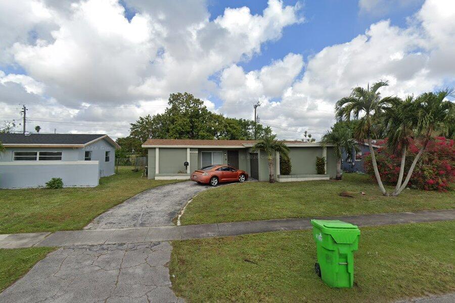 6691 Northwest 30th Street Sunrise, FL 33313 - Photo 26 of 26 a view of a house with a yard