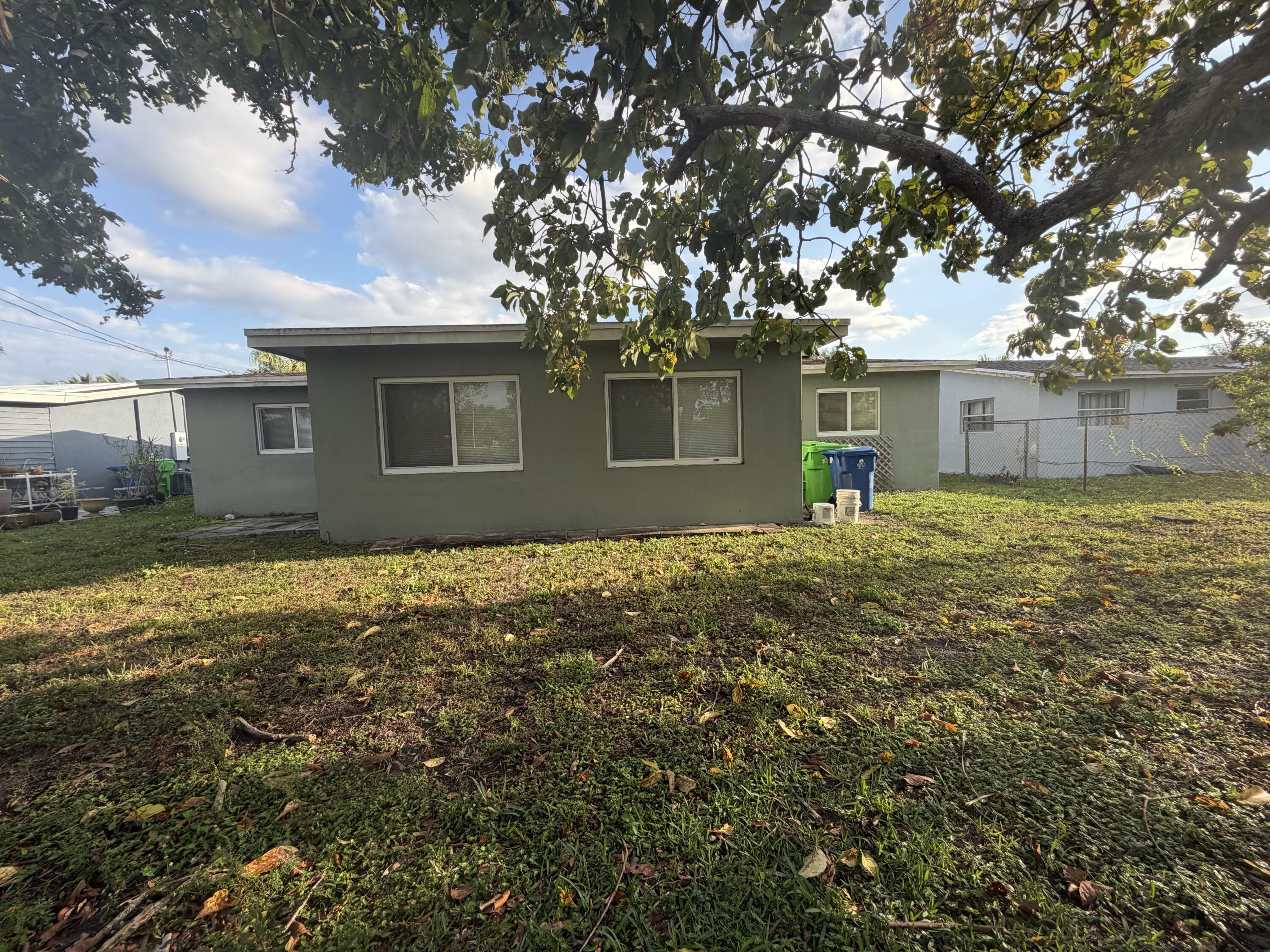 6691 Northwest 30th Street Sunrise, FL 33313 - Photo 3 of 26 front view of a house with a yard