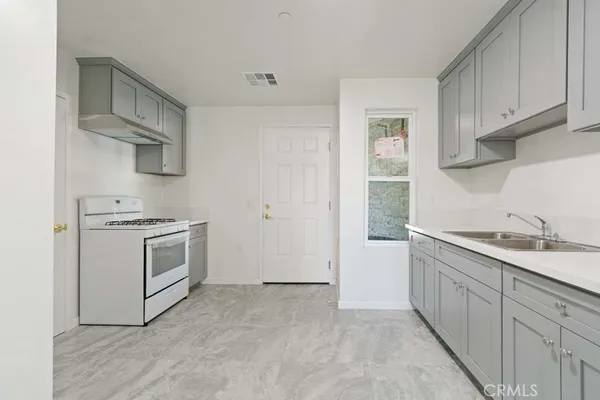 a kitchen with white cabinets