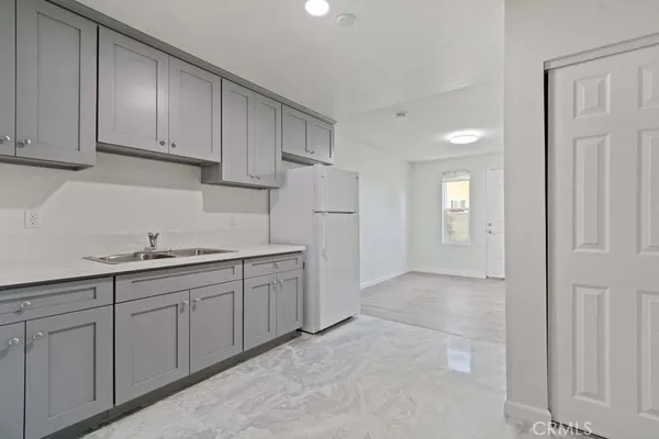 a bathroom with a shower and a sink