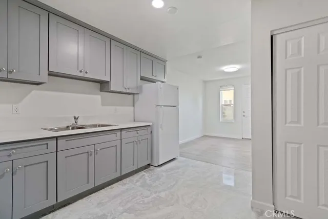 a bathroom with a shower and a sink