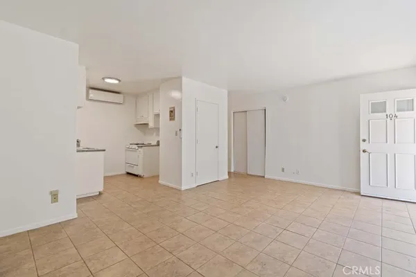 a utility room with cabinets washer and dryer