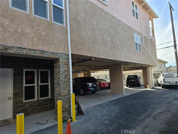 a view of a car parked in front of a building