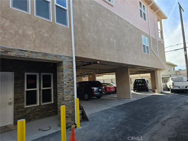 a view of a car parked in front of a building