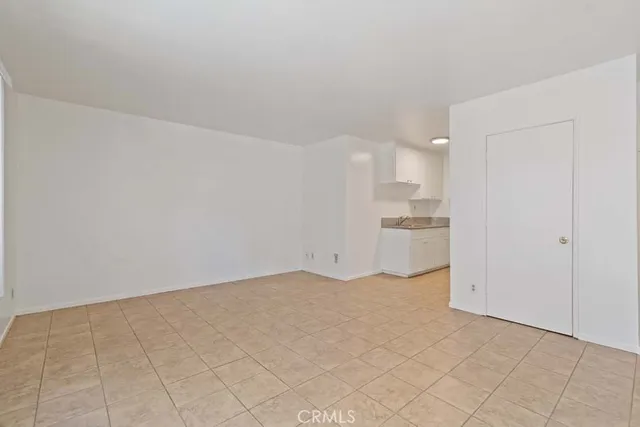 a kitchen with stainless steel appliances a stove top oven and sink