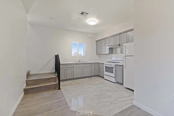 an empty room with closet area