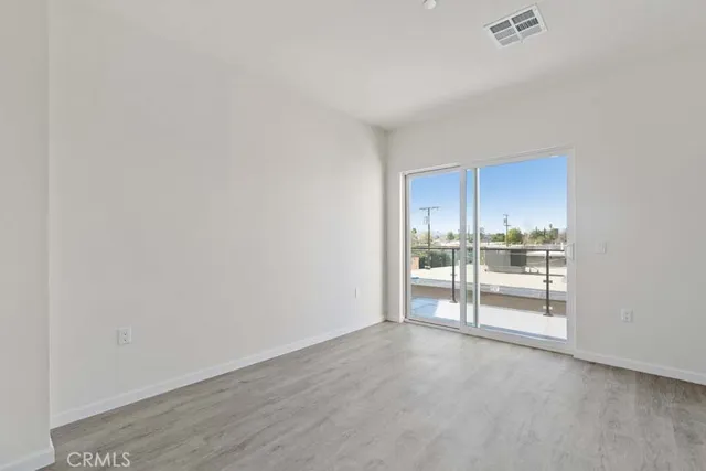 a kitchen with stainless steel appliances granite countertop white cabinets and sink