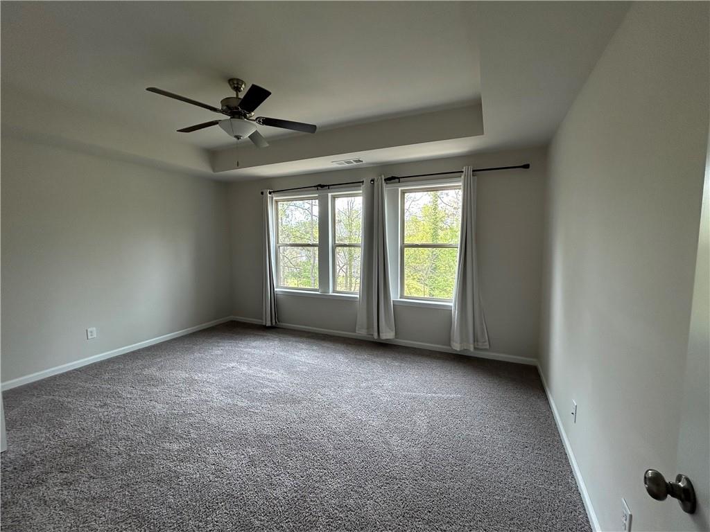 3715 Davis Circle Duluth, GA 30096 - Photo 11 of 20 an empty room with windows and fan view
