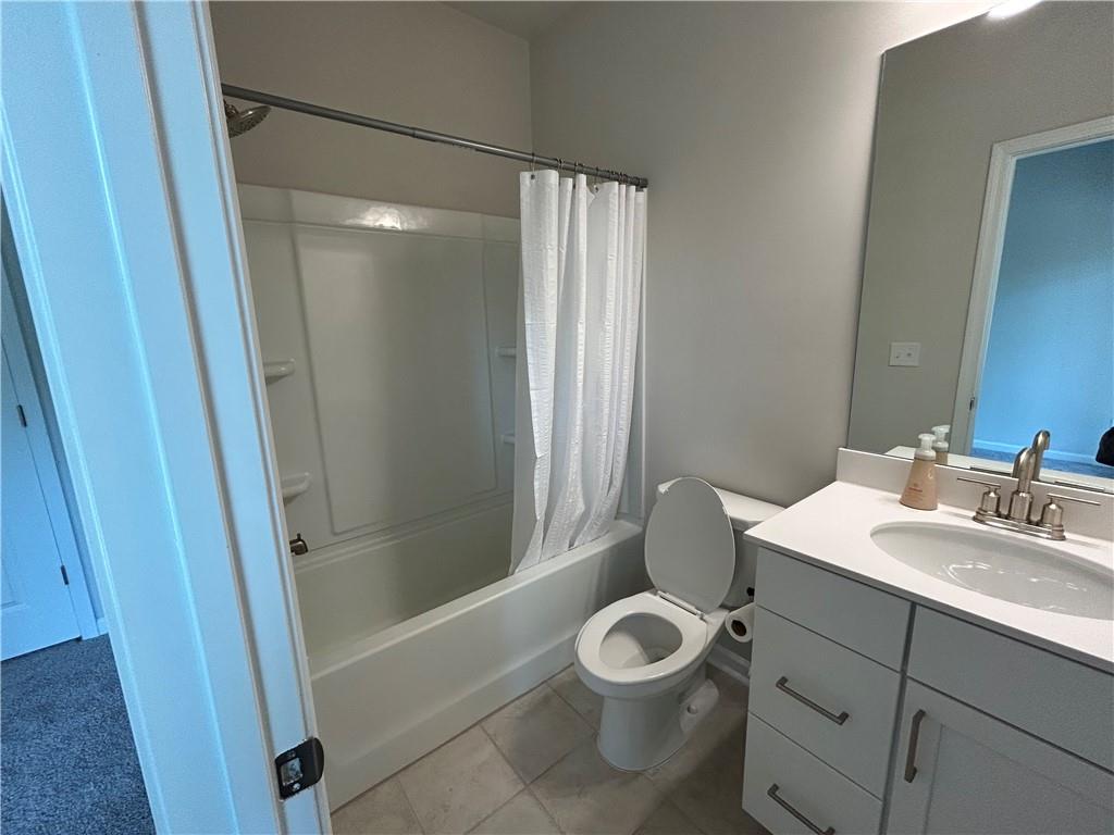3715 Davis Circle Duluth, GA 30096 - Photo 18 of 20 a bathroom with a sink mirror vanity and toilet
