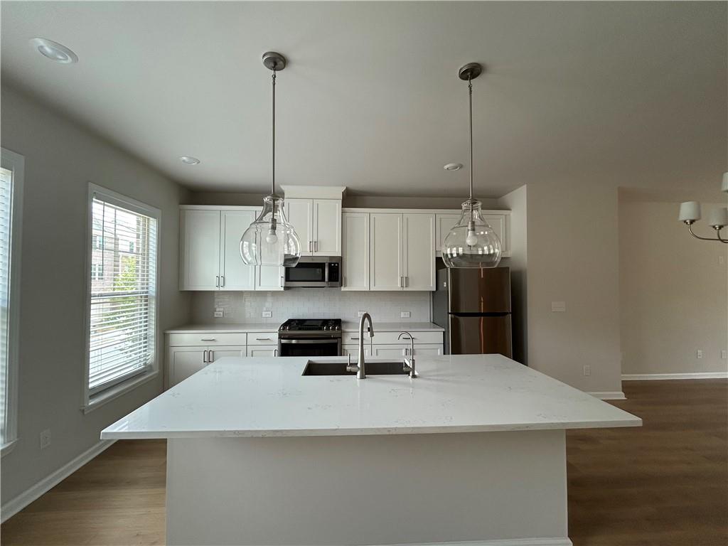 3715 Davis Circle Duluth, GA 30096 - Photo 2 of 20 a kitchen with stainless steel appliances a refrigerator sink and microwave