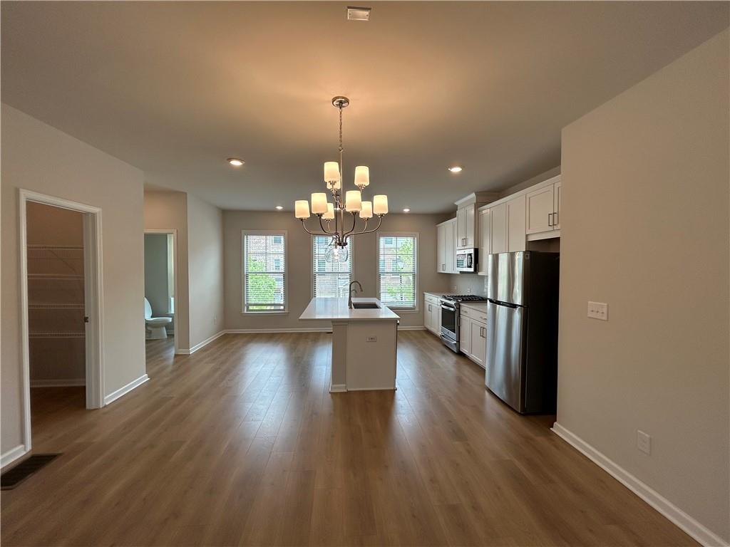 3715 Davis Circle Duluth, GA 30096 - Photo 5 of 20 wooden floor in an empty room with a window