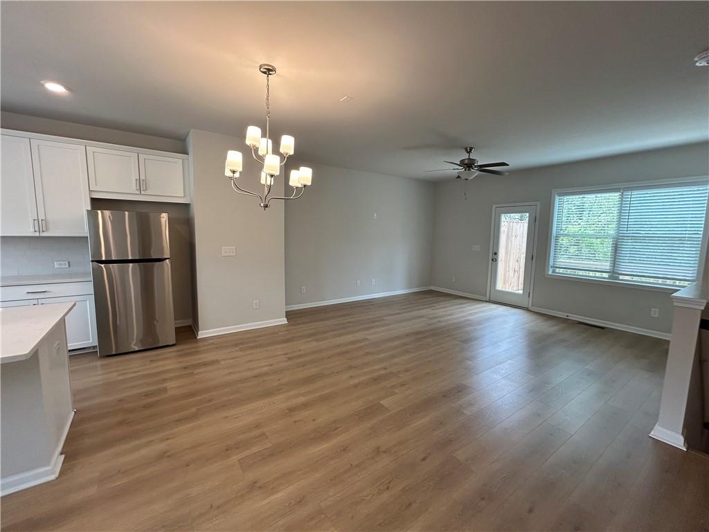 3715 Davis Circle Duluth, GA 30096 - Photo 9 of 20 wooden floor in an empty room with a window