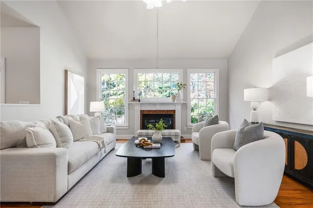 a living room with furniture and a fireplace