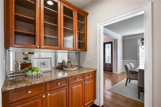 a kitchen with stainless steel appliances granite countertop a sink and cabinets