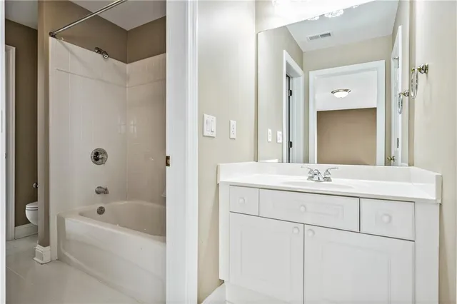 a bathroom with a bathtub and a sink