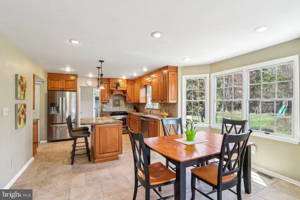 a kitchen with a sink a stove and cabinets