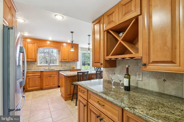 a spacious bedroom with a bed and a chandelier