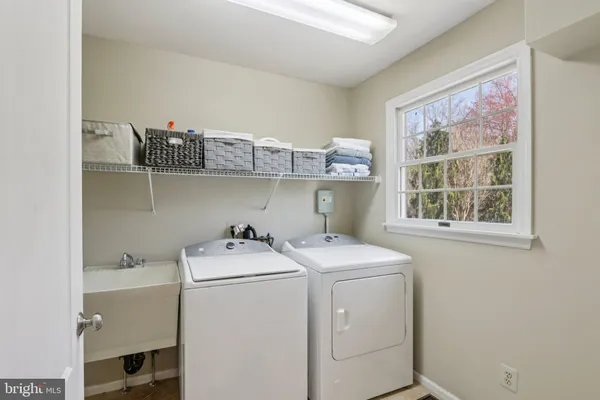 a bath tub sitting in a bathroom next to a window