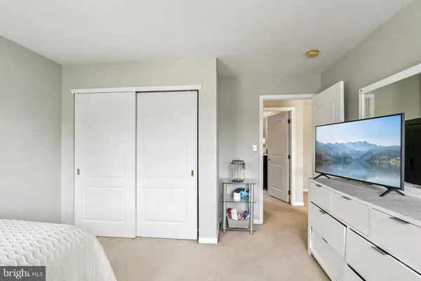a view of a patio with couches table and chairs and potted plants