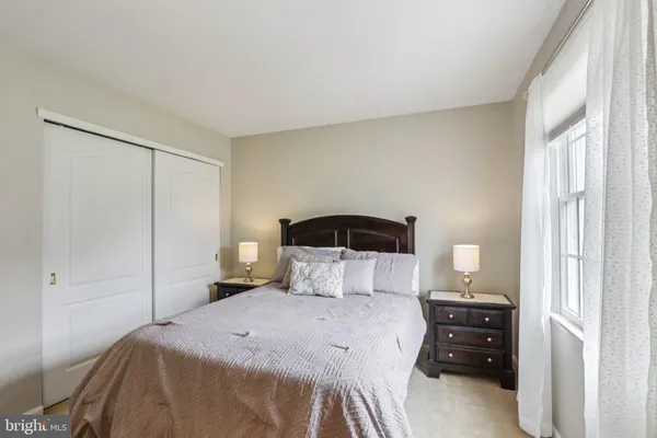 a front view of a house with a garden and plants