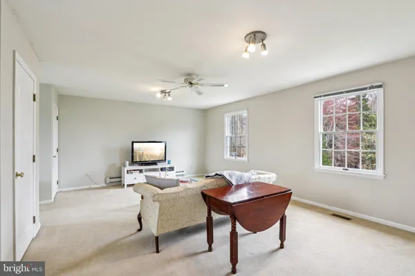 an aerial view of a house with swimming pool garden and patio