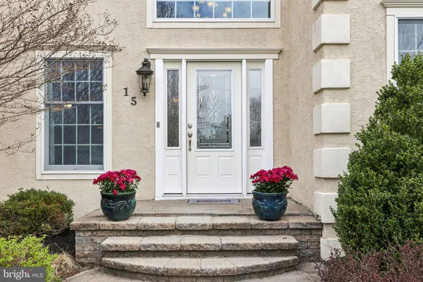 a view of an entryway with wooden floor and door