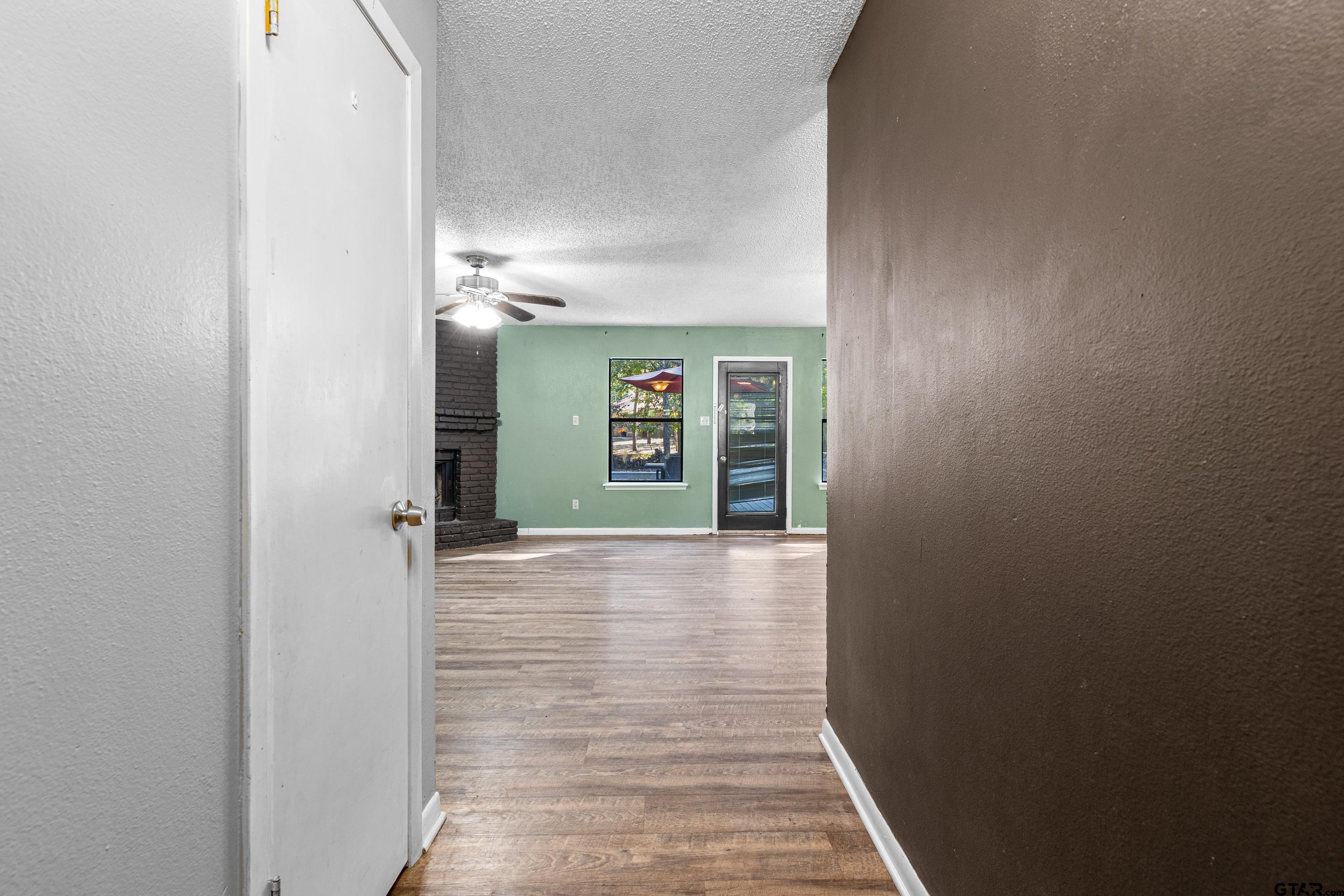 473 Meadow View Path Holly Lake Ranch, TX 75765 - Photo 12 of 37 a view of hallway with wooden floor
