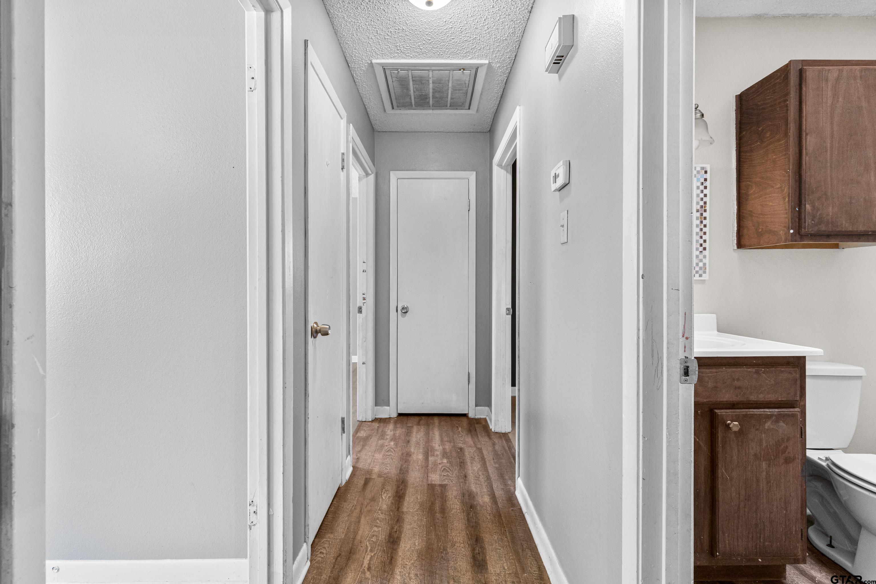 473 Meadow View Path Holly Lake Ranch, TX 75765 - Photo 22 of 37 a view of hallway with wooden floor