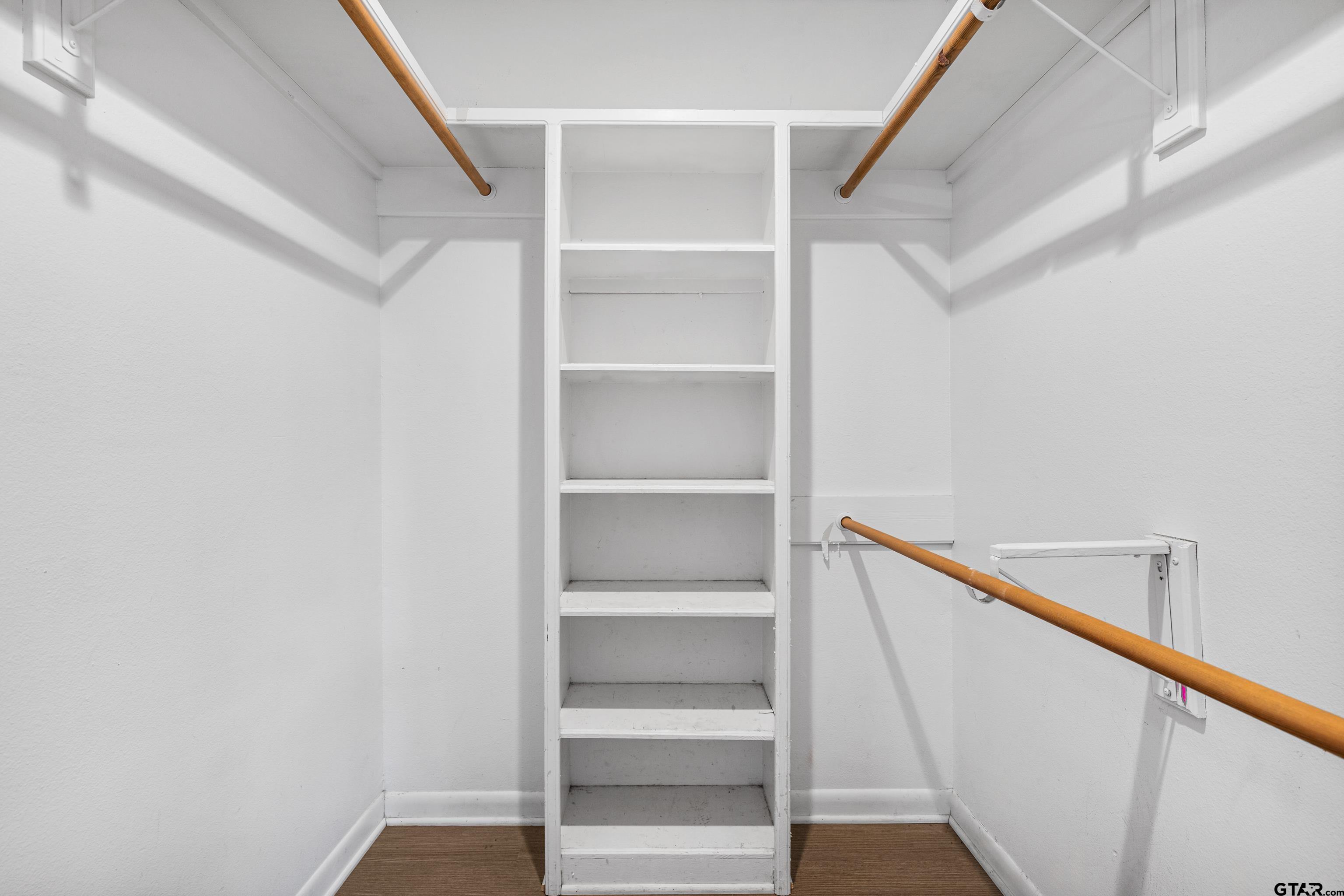 473 Meadow View Path Holly Lake Ranch, TX 75765 - Photo 30 of 37 a view of walk in closet with empty racks