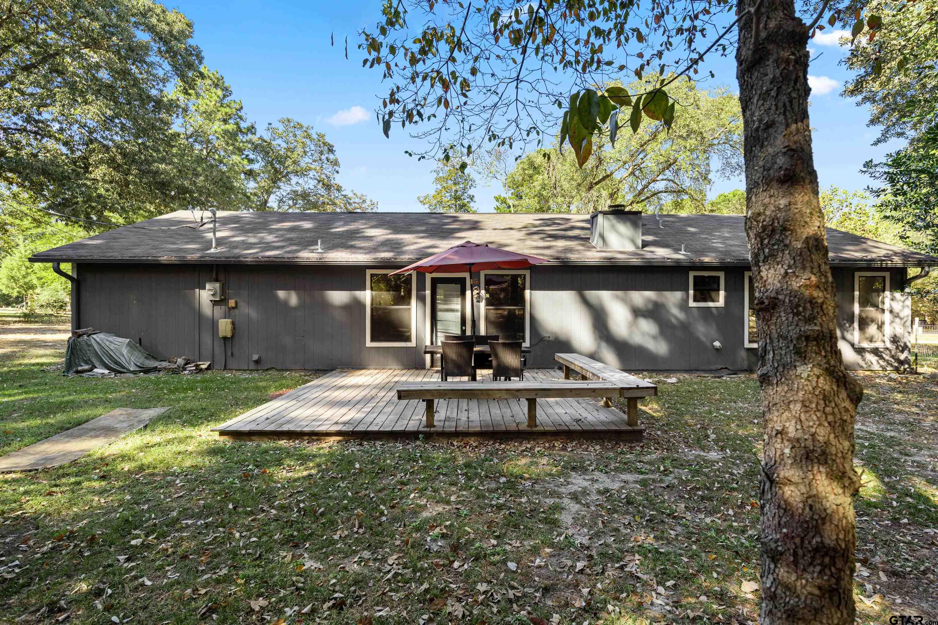473 Meadow View Path Holly Lake Ranch, TX 75765 - Photo 34 of 37 a front view of a house with garden