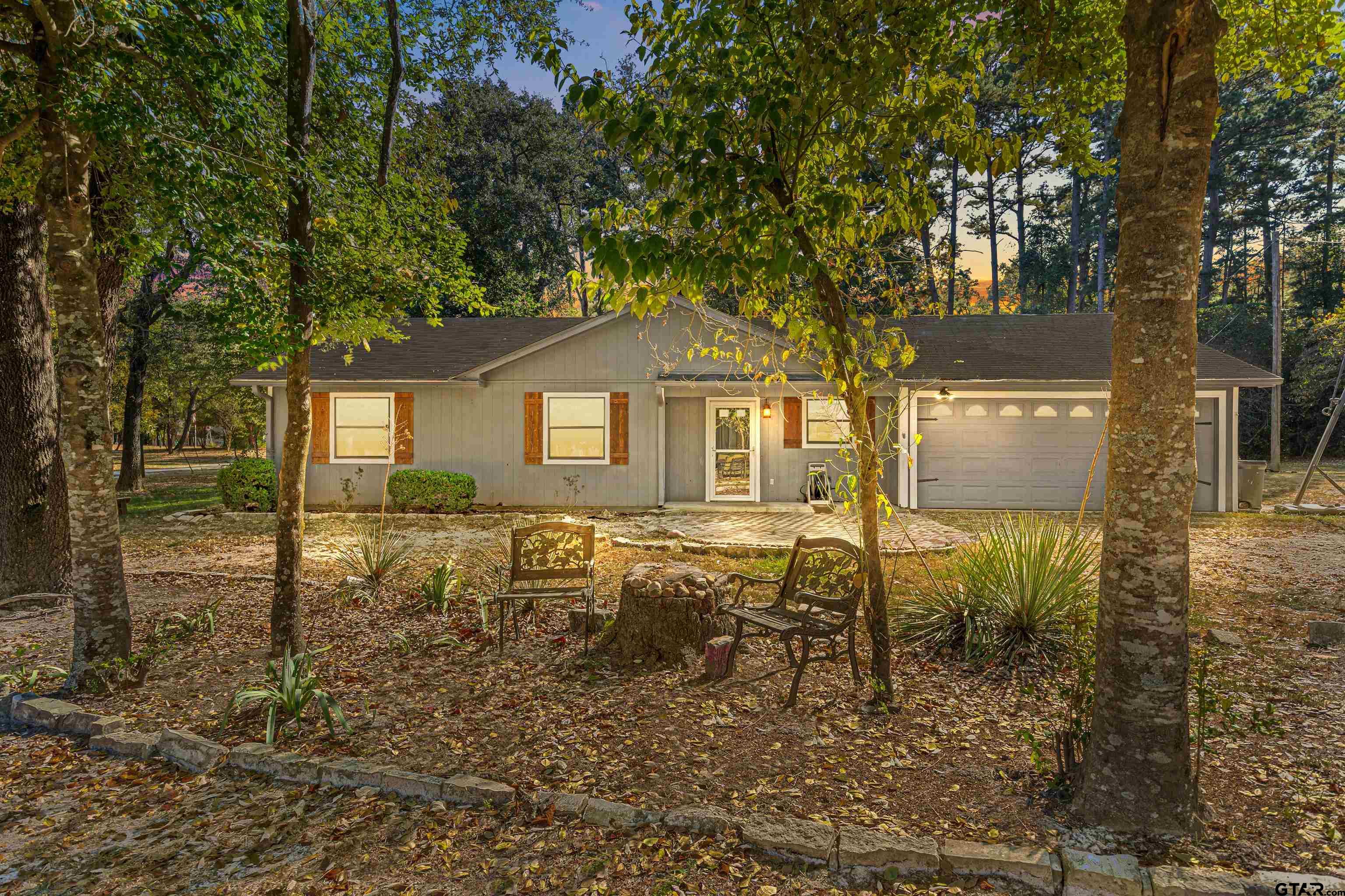 473 Meadow View Path Holly Lake Ranch, TX 75765 - Photo 9 of 37 a front view of a house with garden