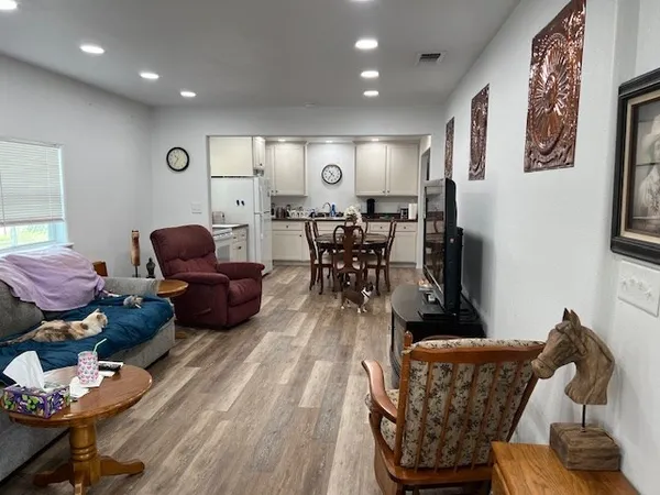 a kitchen with a table chairs stove and microwave