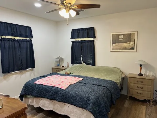 a bedroom with a dresser and a dresser