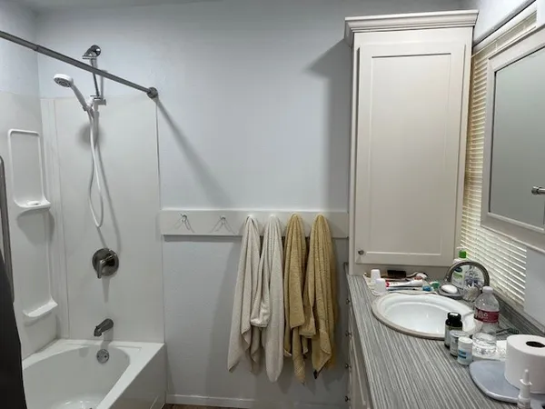 a white toilet sitting next to a bathroom sink