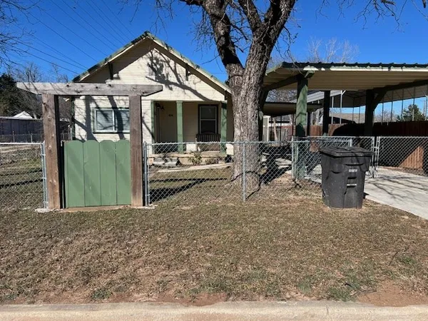 a house with trees in front of it