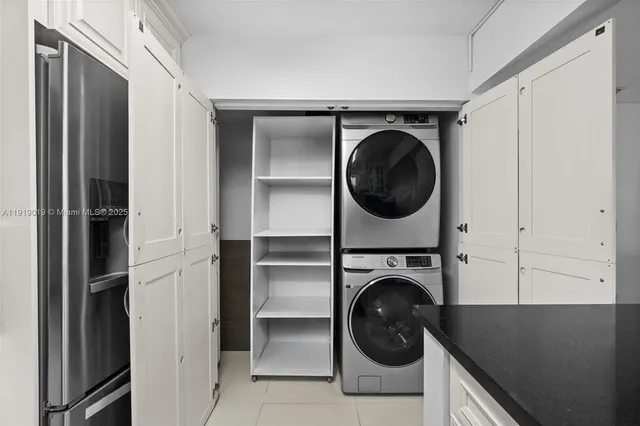 an empty room with wooden floor sink and closet