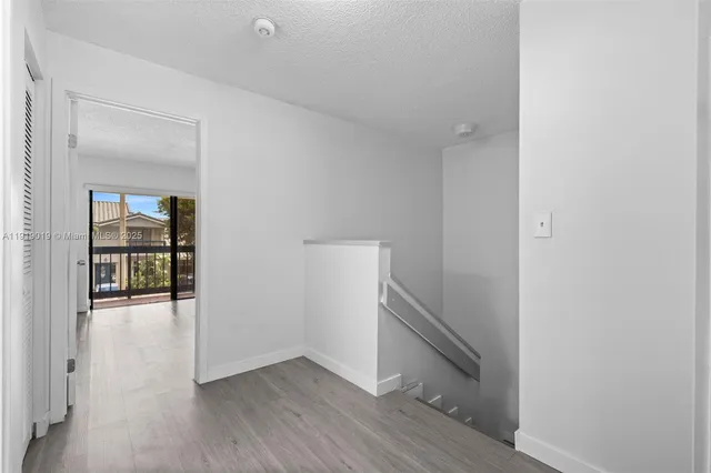 a bedroom with a large bed and a large window
