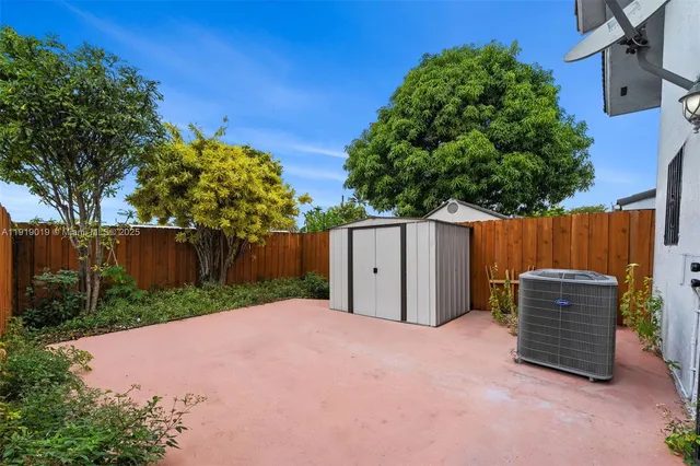 a front view of a house with wooden fence