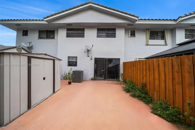 a view of a balcony with an outdoor seating